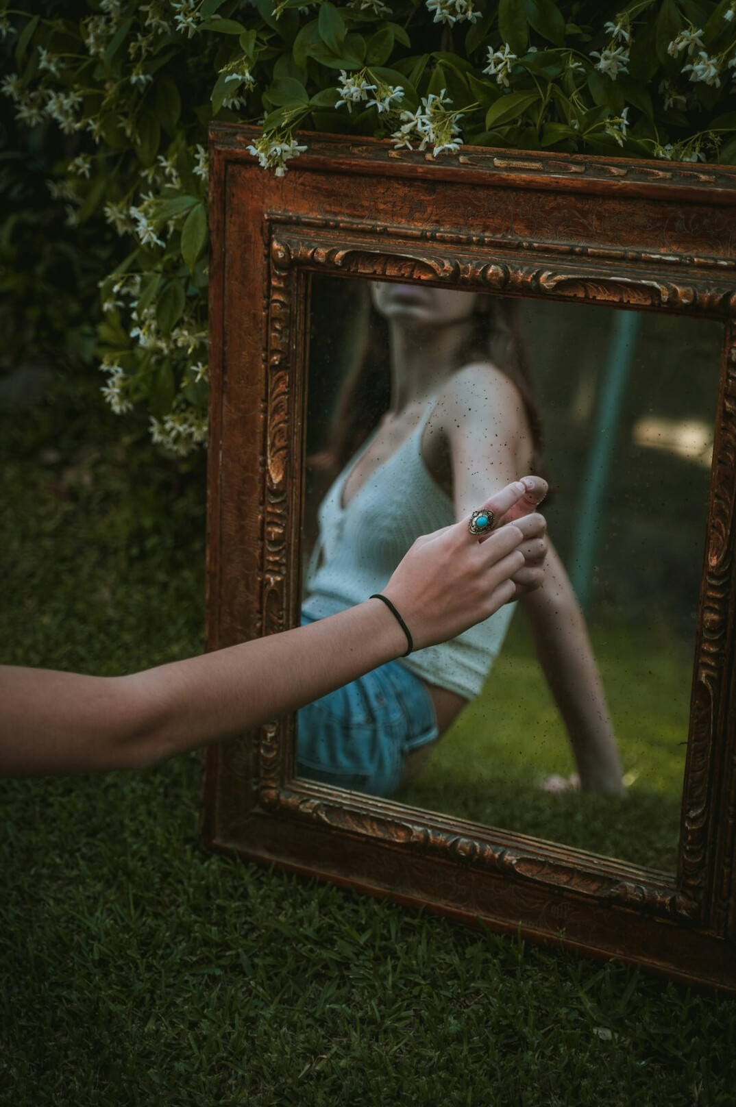 person reflecting in mirror