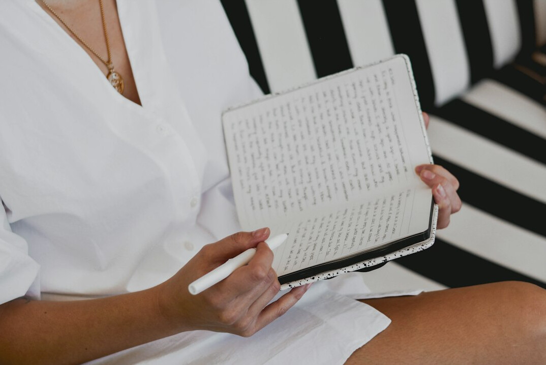 woman writing in journal