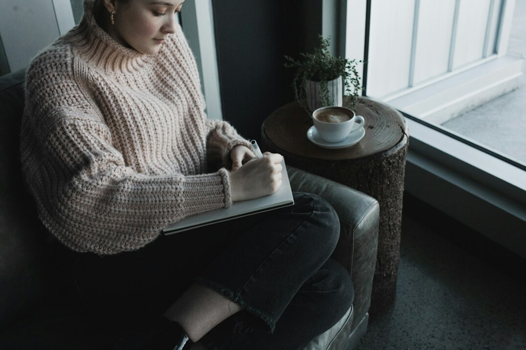 person journaling thoughts