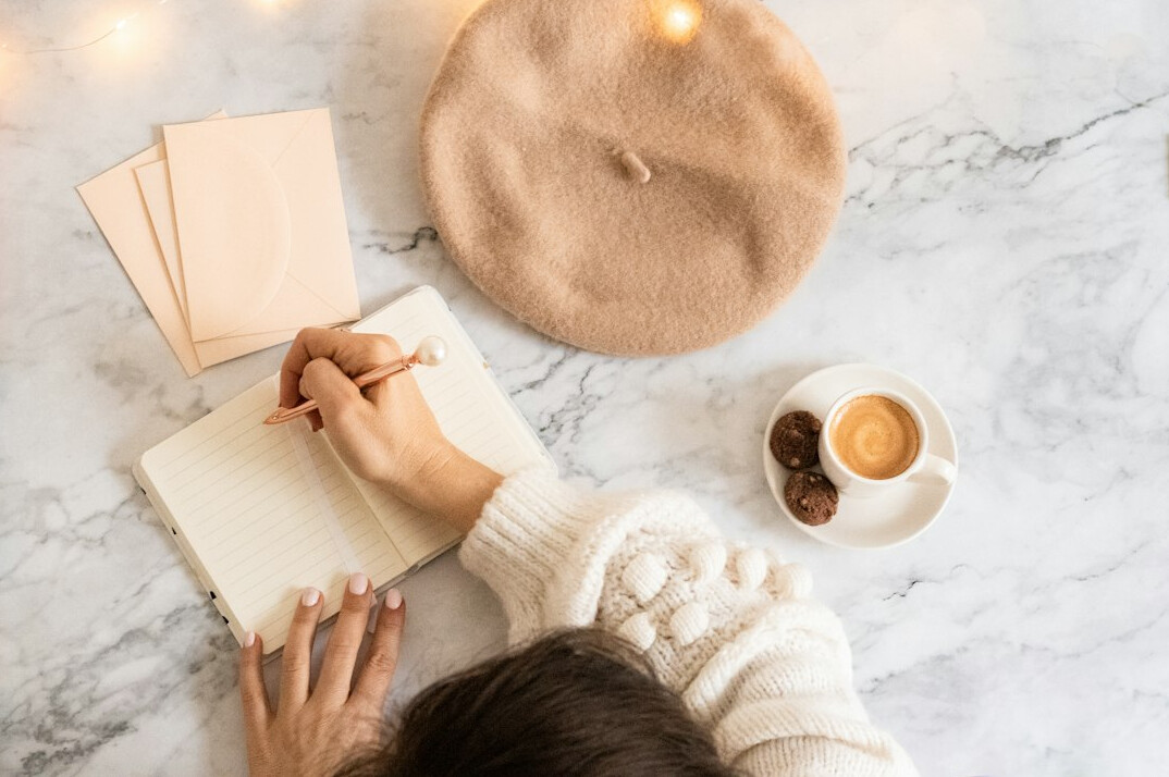 woman writing in journal