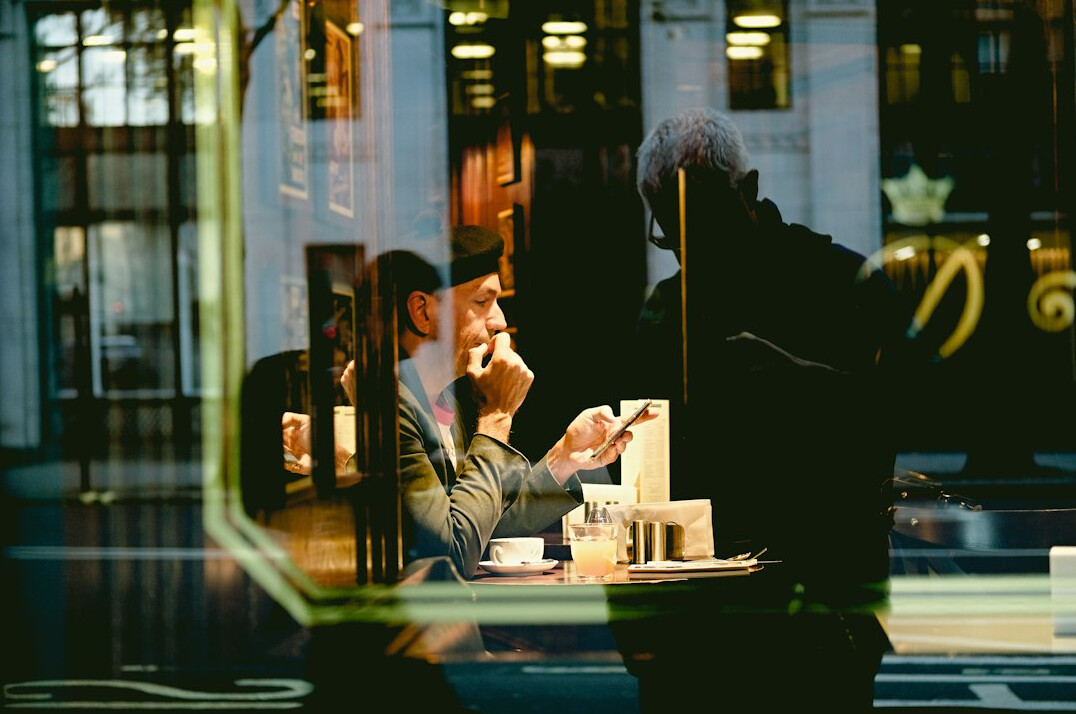 Two colleagues talking during a coffee break